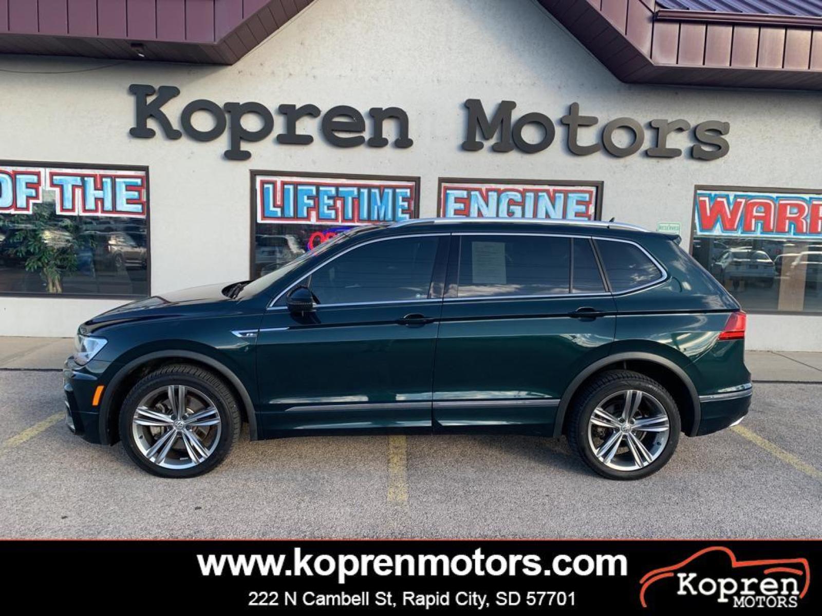2019 Dark Moss Green Metallic /Titan Black Volkswagen Tiguan SEL R-Line (3VV2B7AX5KM) with an L4, 2.0L engine, 8-speed automatic transmission, located at 222 N Cambell St., Rapid City, SD, 57701, (866) 420-2727, 44.081833, -103.191032 - <b>Equipment</b><br>It features a hands-free Bluetooth phone system. The vehicle has satellite radio capabilities. Protect this model from unwanted accidents with a cutting edge backup camera system. The vehicle has a clean CARFAX vehicle history report. Apple CarPlay: Seamless smartphone integratio - Photo #0