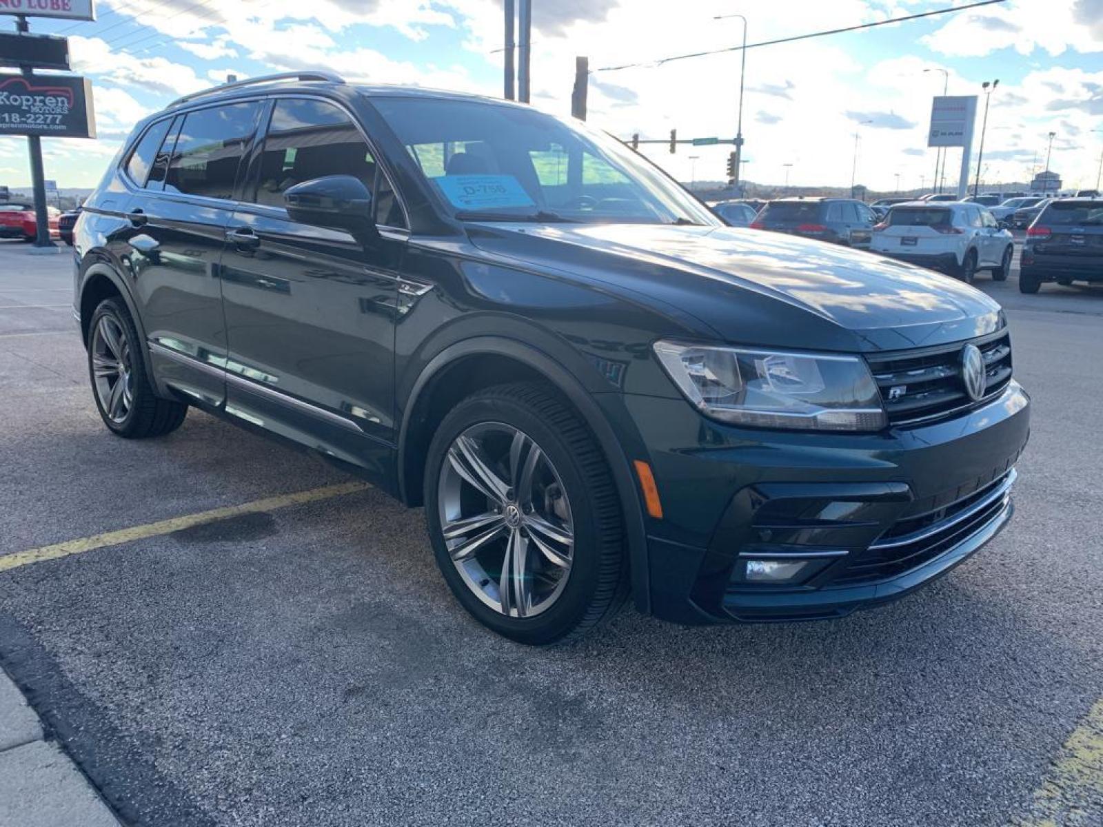 2019 Dark Moss Green Metallic /Titan Black Volkswagen Tiguan SEL R-Line (3VV2B7AX5KM) with an L4, 2.0L engine, 8-speed automatic transmission, located at 222 N Cambell St., Rapid City, SD, 57701, (866) 420-2727, 44.081833, -103.191032 - <b>Equipment</b><br>It features a hands-free Bluetooth phone system. The vehicle has satellite radio capabilities. Protect this model from unwanted accidents with a cutting edge backup camera system. The vehicle has a clean CARFAX vehicle history report. Apple CarPlay: Seamless smartphone integratio - Photo #3
