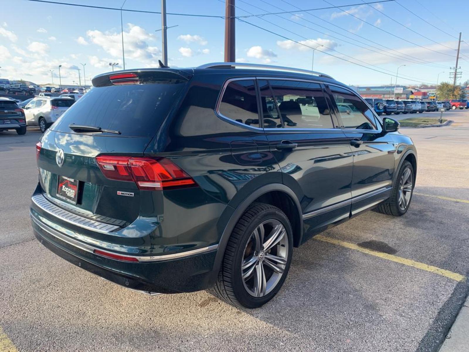 2019 Dark Moss Green Metallic /Titan Black Volkswagen Tiguan SEL R-Line (3VV2B7AX5KM) with an L4, 2.0L engine, 8-speed automatic transmission, located at 222 N Cambell St., Rapid City, SD, 57701, (866) 420-2727, 44.081833, -103.191032 - <b>Equipment</b><br>It features a hands-free Bluetooth phone system. The vehicle has satellite radio capabilities. Protect this model from unwanted accidents with a cutting edge backup camera system. The vehicle has a clean CARFAX vehicle history report. Apple CarPlay: Seamless smartphone integratio - Photo #4