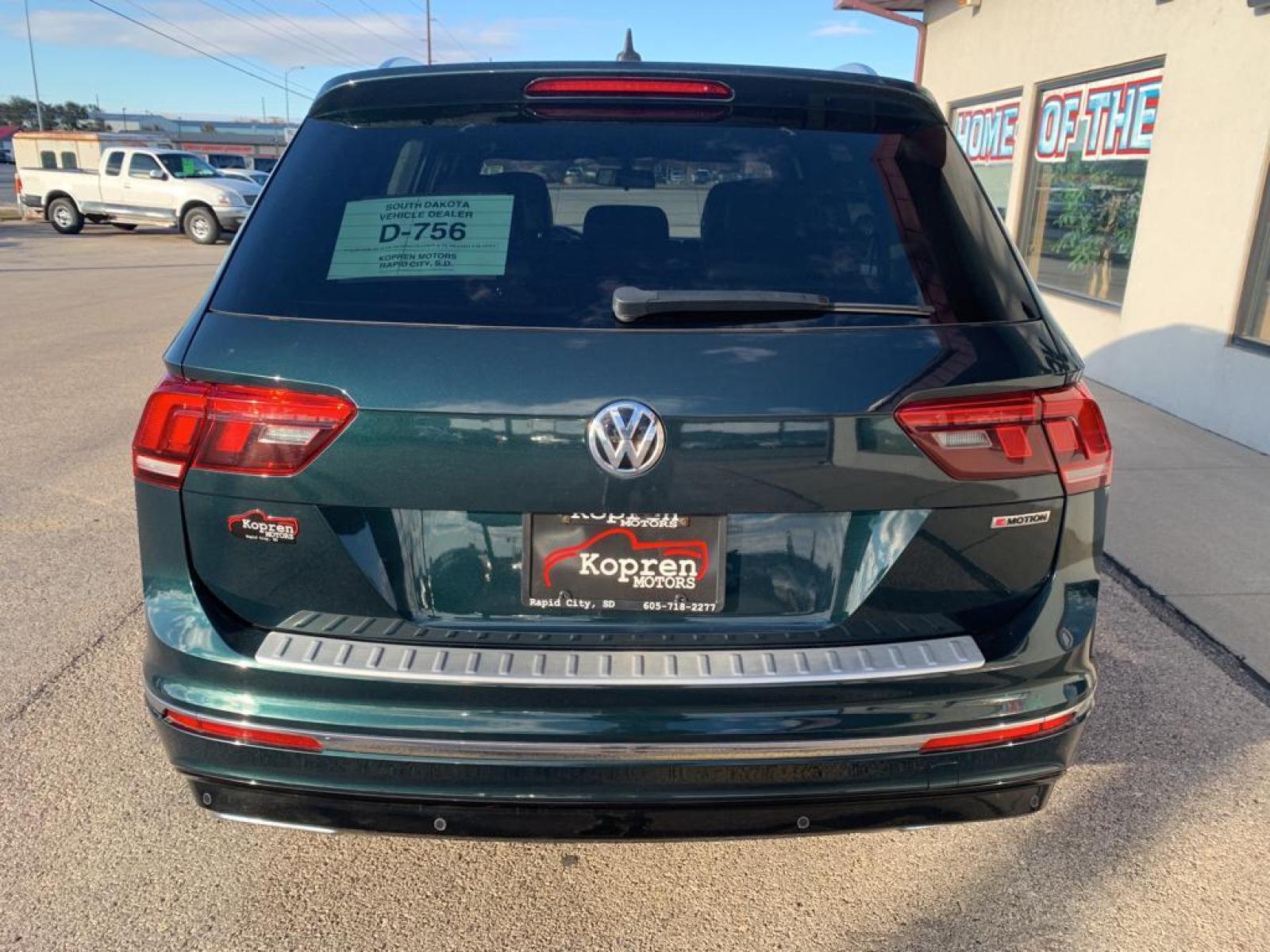 2019 Dark Moss Green Metallic /Titan Black Volkswagen Tiguan SEL R-Line (3VV2B7AX5KM) with an L4, 2.0L engine, 8-speed automatic transmission, located at 222 N Cambell St., Rapid City, SD, 57701, (866) 420-2727, 44.081833, -103.191032 - <b>Equipment</b><br>It features a hands-free Bluetooth phone system. The vehicle has satellite radio capabilities. Protect this model from unwanted accidents with a cutting edge backup camera system. The vehicle has a clean CARFAX vehicle history report. Apple CarPlay: Seamless smartphone integratio - Photo #5
