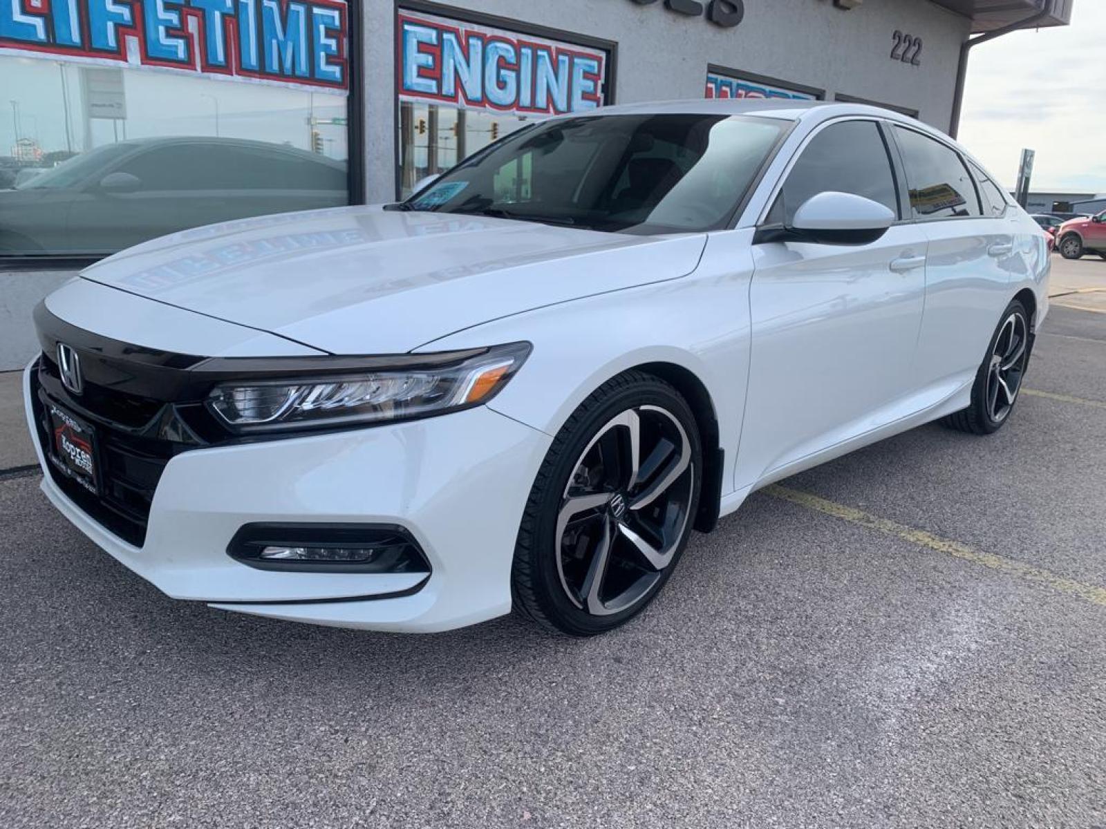 2018 Platinum White Pearl /Black Honda Accord Sport 1.5T (1HGCV1F34JA) with an L4, 1.5L engine, CVT transmission, located at 222 N Cambell St., Rapid City, SD, 57701, (866) 420-2727, 44.081833, -103.191032 - It offers Apple CarPlay for seamless connectivity. Protect this vehicle from unwanted accidents with a cutting edge backup camera system. The vehicle has auto-adjust speed for safe following. The vehicle features a hands-free Bluetooth phone system. This model offers Automatic Climate Control for pe - Photo #1