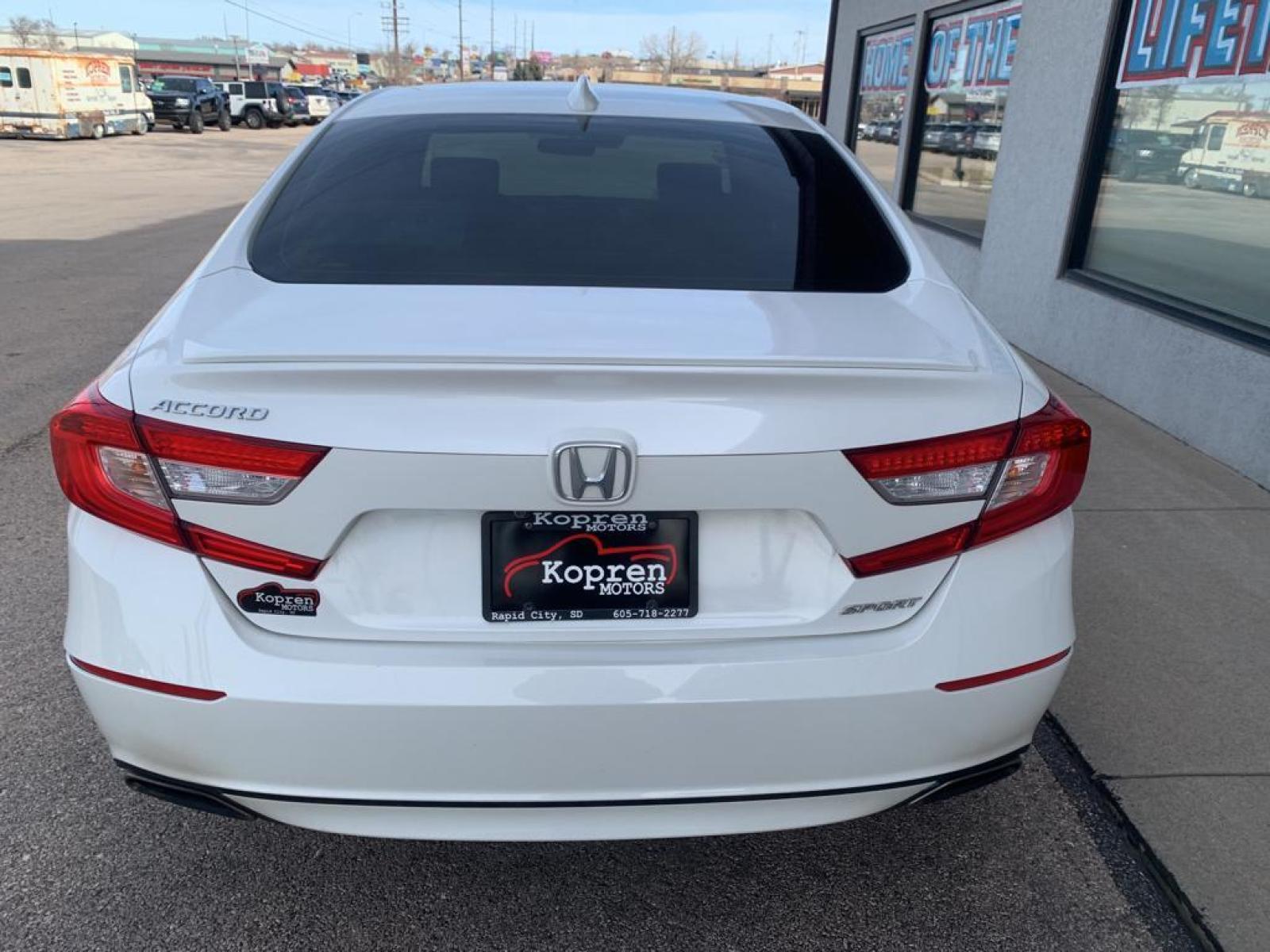 2018 Platinum White Pearl /Black Honda Accord Sport 1.5T (1HGCV1F34JA) with an L4, 1.5L engine, CVT transmission, located at 222 N Cambell St., Rapid City, SD, 57701, (866) 420-2727, 44.081833, -103.191032 - It offers Apple CarPlay for seamless connectivity. Protect this vehicle from unwanted accidents with a cutting edge backup camera system. The vehicle has auto-adjust speed for safe following. The vehicle features a hands-free Bluetooth phone system. This model offers Automatic Climate Control for pe - Photo #5